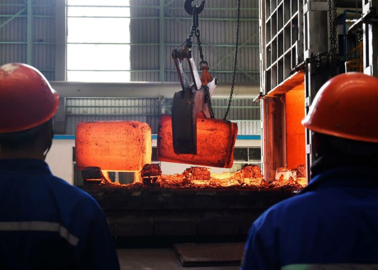 Työntekijöitä kiinalaisella terästehtaalla Zoupingissä maaliskuussa 2018.