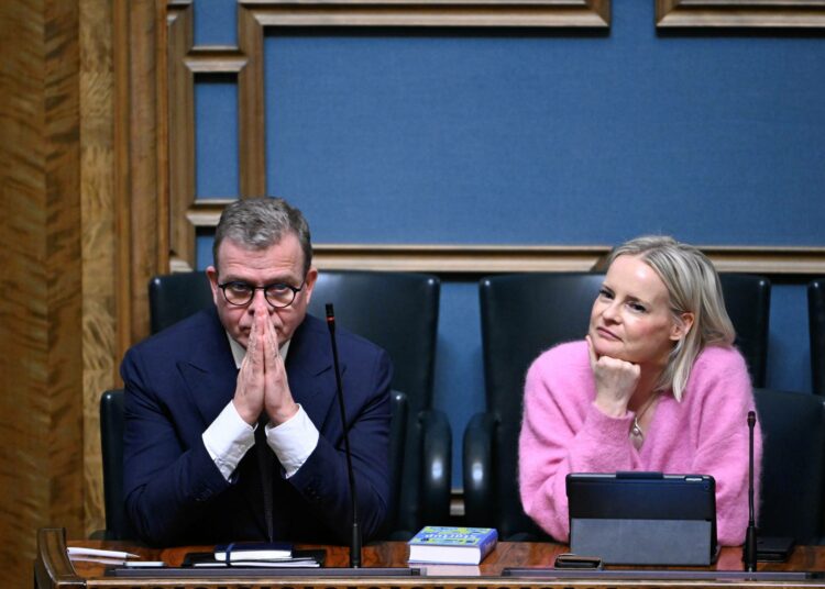 Pääministeri Petteri Orpo ja valtiovarainministeri Riikka Purra eduskunnan täysistunnossa 25. helmikuuta 2026.