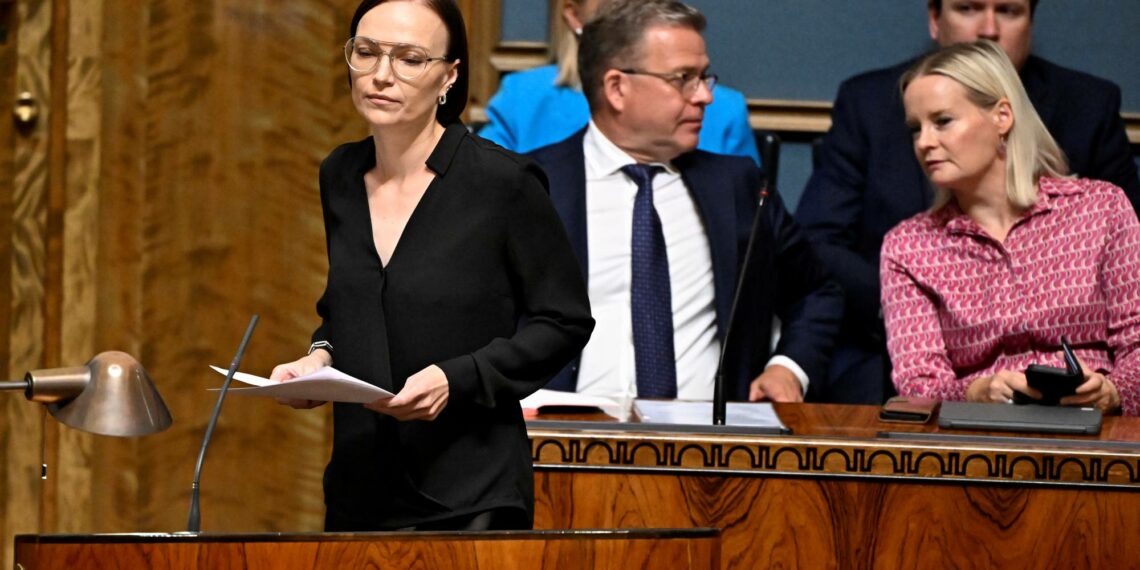 Vasemmistoliiton puheenjohtaja Minja Koskela, pääministeri Petteri Orpo (kok.) ja valtiovarainministeri Riikka Purra (ps.) eduskunnassa heinäkuussa.