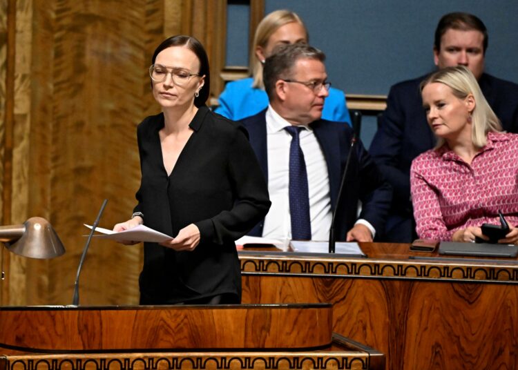 Vasemmistoliiton puheenjohtaja Minja Koskela, pääministeri Petteri Orpo (kok.) ja valtiovarainministeri Riikka Purra (ps.) eduskunnassa heinäkuussa.